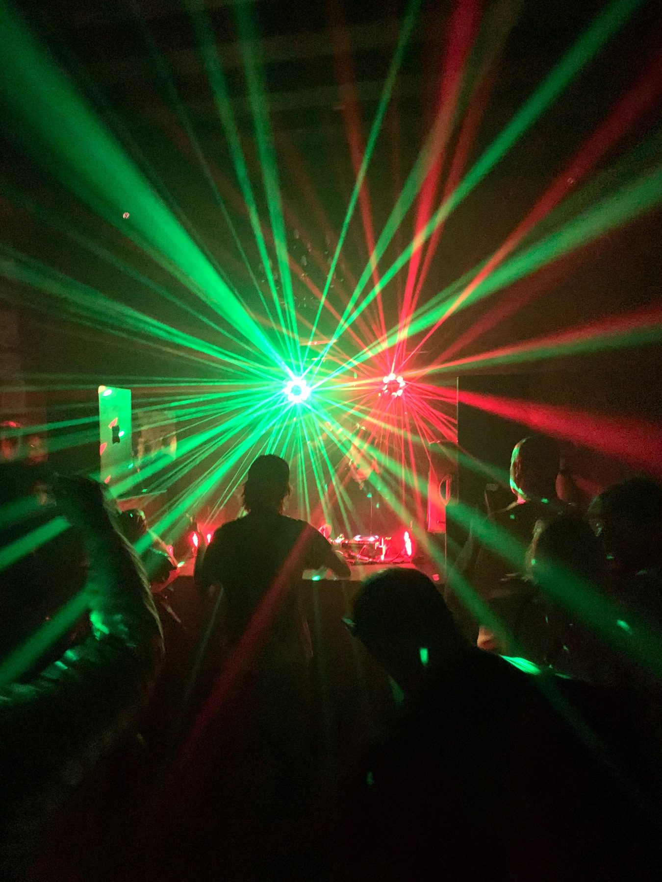 Green lasers fanning out over the crowd