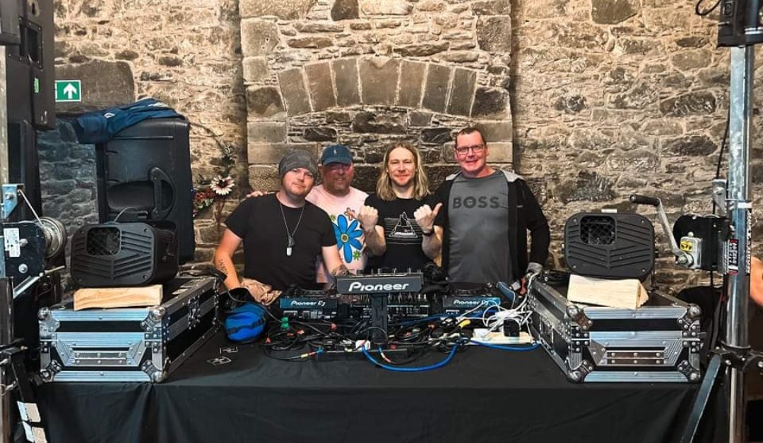 Outdoor DJ booth against the castle wall