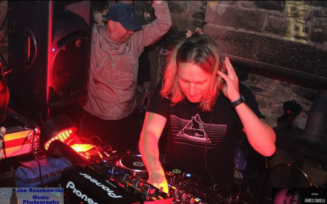 DJ mixing to a packed room
