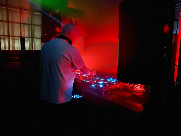 DJ playing beside the castle window