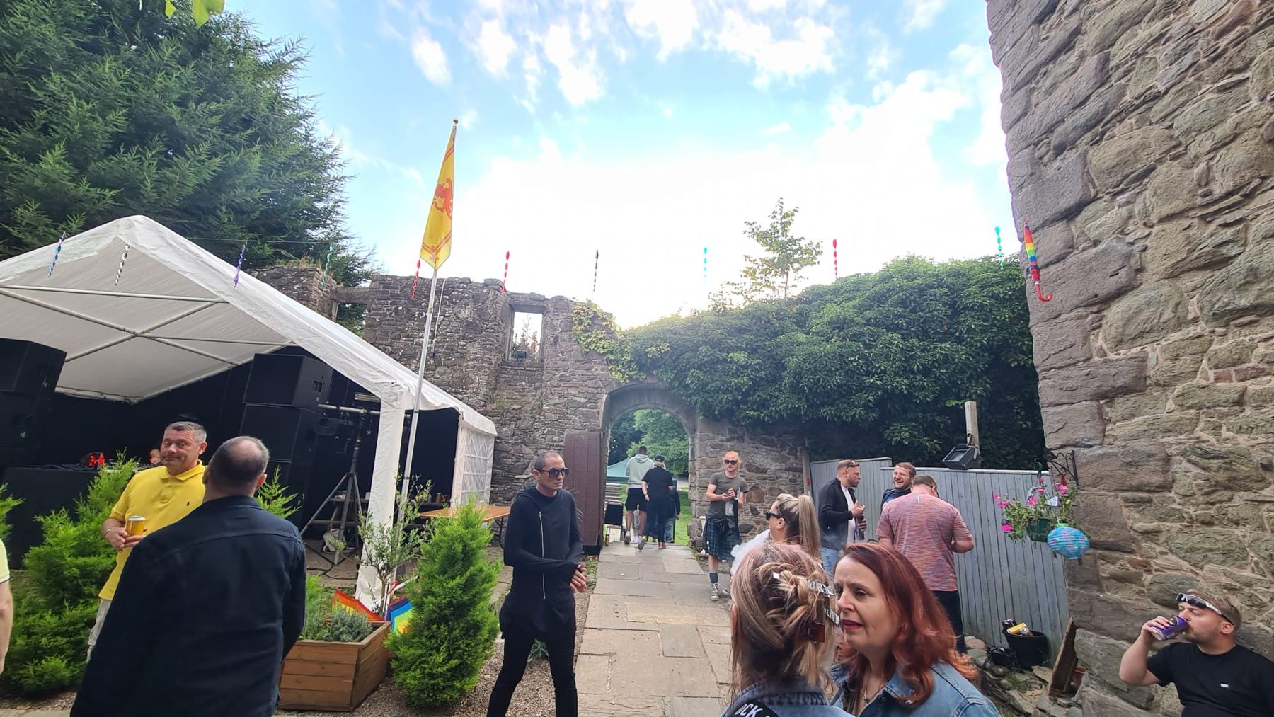 Crowd gathering in the walled castle courtyard